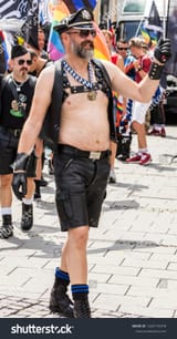 stock-photo-munich-bavaria-germany-july-an-almost-naked-gay-man-wearing-leather-harness-1443176378