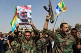 syrian-officers-hold-photos-major-general-issam-550nw-9165022e
