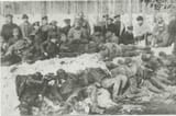 Bolsheviks [Jews and Atheists] pose with their victims, Murmansk Region, 1918-1919