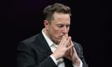 Elon-Musk-with-his-hands-in-front-of-his-face