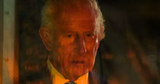 king stares into the fire