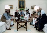 800px-Reagan_sitting_with_people_from_the_Afghanistan-Pakistan_region_in_February_1983