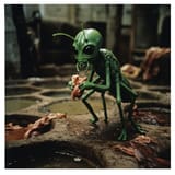 1750668611_imagen_a_tired_green_fleshed_insectoid_alien_bum_drags_a_scrap_of_food_out_of_the_turkish_tannery_pits._flashbulb_real_photograph_reality_1997_photo_album._1