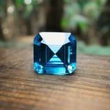 1060551763_4_carat_blue_zircon_on_a_table_in_Cambodian_jungle