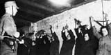 1933_SAMemberArrestsCommunists_FH229435