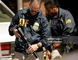 upland-april-20-2006-thomas-j-makar-resident-agent-in-charge-atf-inspects-a-gun