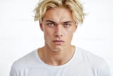 portrait-of-a-young-man-with-blonde-hair-and-blue-eyes-photo