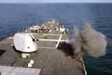USS_Carney_fires_its_five_inch_deck_gun