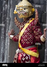 khmer-dancer-in-demon-costume-at-bayon-temple-within-the-walls-of-DYXD82