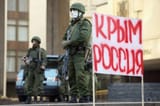 Heavily armed soldiers without insignia block Crimean parliament sign reads Crimea (is) Russia 1 Mar 2014 Simferopol