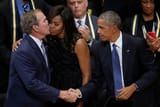 michelle-obama-george-bush-kiss-on-cheek-2