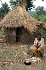 african-boy-mud-hut-19039279