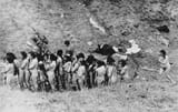 1024px-Naked_Jewish_women_wait_in_a_line_before_their_execution_by_Ukrainian_auxiliary_police