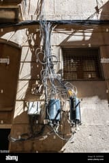 power-lines-and-cables-on-the-facade-of-the-house-barcelona-catalonia-spain-2KPE5WG