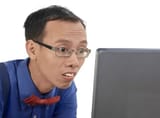depositphotos_122357102-stock-photo-nerd-man-using-laptop