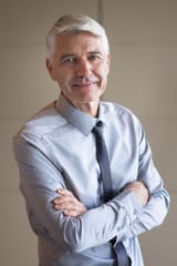 closeup-senior-businessman-with-arms-crossed