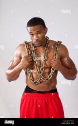muscular-african-american-black-man-with-a-heavy-chain-around-his-CFRXXP