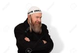 160094464-sly-bearded-jewish-man-smiling-cunningly-looking-at-the-camera-over-white-background-charming