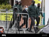 national-party-leader-justin-barrett-centre-is-escorted-by-supporters-out-of-the-count-centre-for-the-dubl...dublin-picture-date-friday-july-9-2021-see-pa-story-irish-byelection-photo-credit-should-read-brian-lawlesspa-wire-2G6YH4B