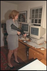 woman-pointing-a-gun-at-a-computer-for-some-reason-1998-v0-up0w0nqzthle1_webp