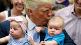 donald-trump_kiss_babies_AP