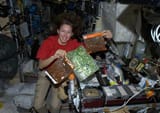 space woman in space kitchen