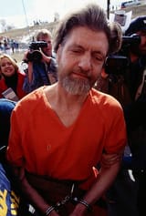 surrounded-by-the-media-and-other-theodore-kaczynski-aka-the-unabomber-is-escorted-to-a-court