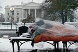 homeless-man-by-white-house-in-winter-bettmann