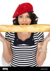 confident-happy-young-woman-wearing-a-red-beret-and-striped-top-holding-EHRGRA
