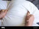 hands-holding-pillow-smothering-suffocating-murder-2BPGYCW