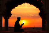 silhouette-muslim-man-traditional-hat-praying-sunset-desert-arch-golden-sun-background-eid-al-adha-mubarak-325221022