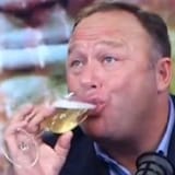 Alex Jones drinking champagne