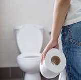 midsection-of-woman-holding-toilet-paper-while-royalty-free-image-1584638519[1]