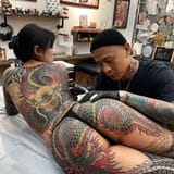 asian getting tattooed