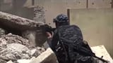 shows-exterior-shots-iraqi-soldiers-sheltering-behind-piles-of-rubble-and-round-corners-of