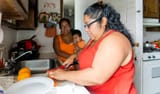 the-bodypositive-beautiful-mexicanamerican-woman-making-fruit-salad-picture-id1028487472-621834112
