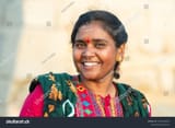 stock-photo-portrait-of-an-indian-woman-dressed-in-traditional-colorful-clothes-bindi-dot-on-her-forehead-2624116025