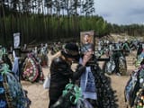 photo-of-a-ukrainian-woman-mourning-her-son-in-irpin-cemetery.jpg
