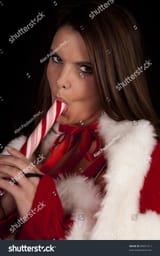 stock-photo-a-woman-in-a-santa-outfit-sucking-on-a-peppermint-stick-89091211