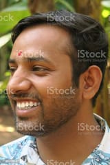 image-of-happy-young-indian-hindu-man-smiling-with-perfect-white-teeth-and-red-bindi-drop-dot