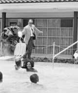 Motel-manager-pouring-acid-in-the-water-when-Black-people-swam-in-his-pool-1964.-Photo-provided-by-Rare-Historical-Photos-854x1024