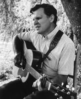 MAR24-Doc-Watson_Playing-the-Guitar-1964__GettyImages