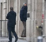 former-israeli-pm-ehud-barak-hides-his-face-as-he-enters-v0-v84m8wozlfac1