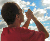 Man-praying-toward-sky