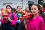 4.-Sikkimese-Lepcha-Girls-Dressed-in-the-Traditional-Bakhu-with-Buddhist-Scriptures-Rested-on-Their-Shoulders