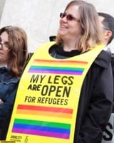 my-legs-are-open-for-refugees-woman-sign-amnesty-international-protest