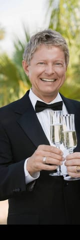 newlywed-gay-couple-toasting-each-other-with-champagne-AHEMWN (1)
