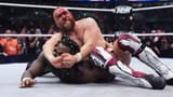 Byran-Danielson-bleeds-whilst-applying-a-cross-face-to-Swerve-Strickland-960x540[1]