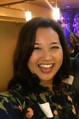 Smiling Woman at Cozy Bar