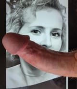 Using her mouth